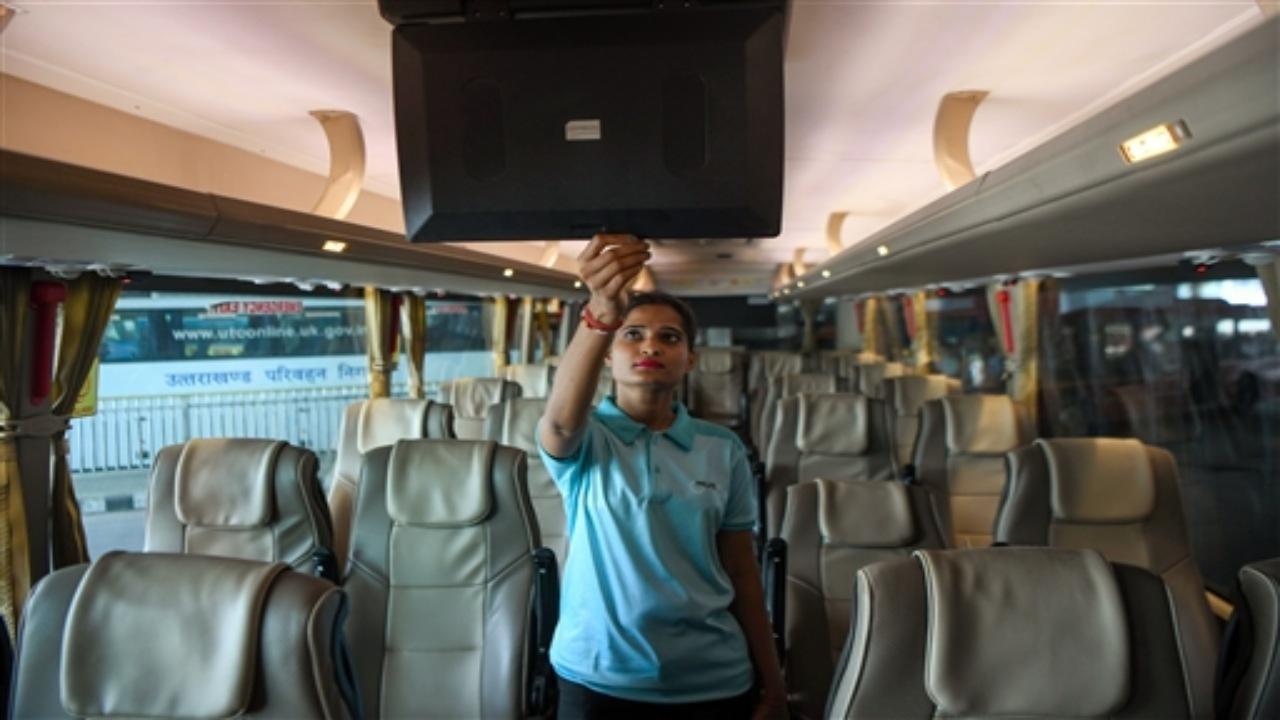 A woman staff employed after an inter-city bus launched by the GreenCell Mobility CEO & MD Devendra Chawla at the flag off ceremony at ISBT Delhi in New Delhi on Tuesday. ANI Photo