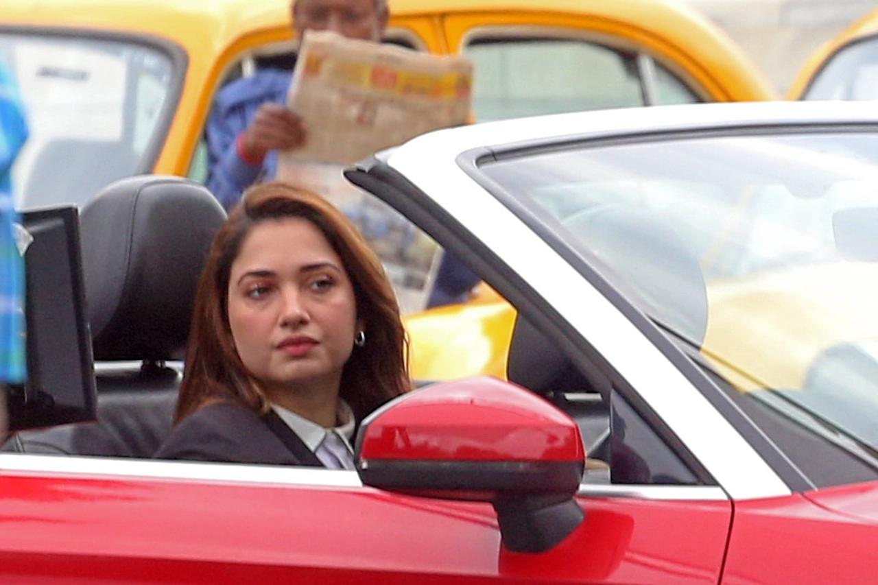 Tamannaah was seen dressed in a lawyers outfit and driving a red car