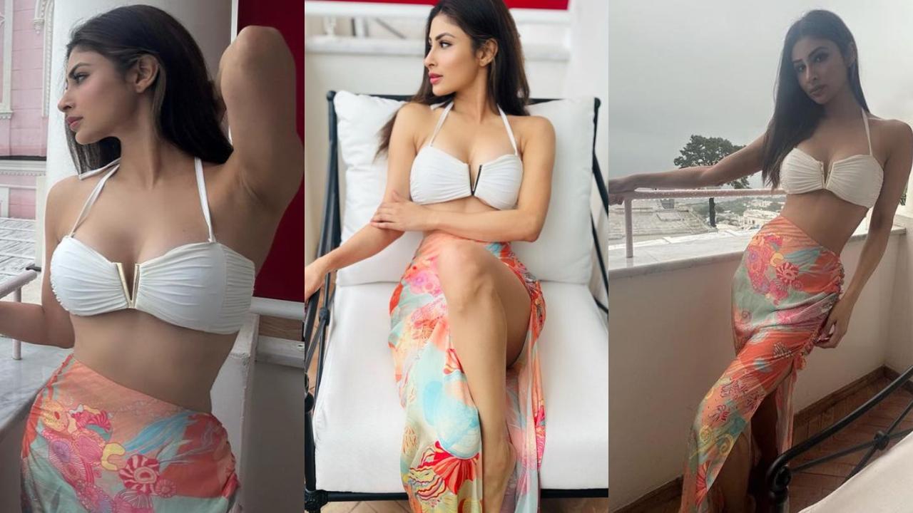 In these multiple pictures from her Italy vacation, Mouni Roy stunned in a white bralette with a plunging neckline and sarong.