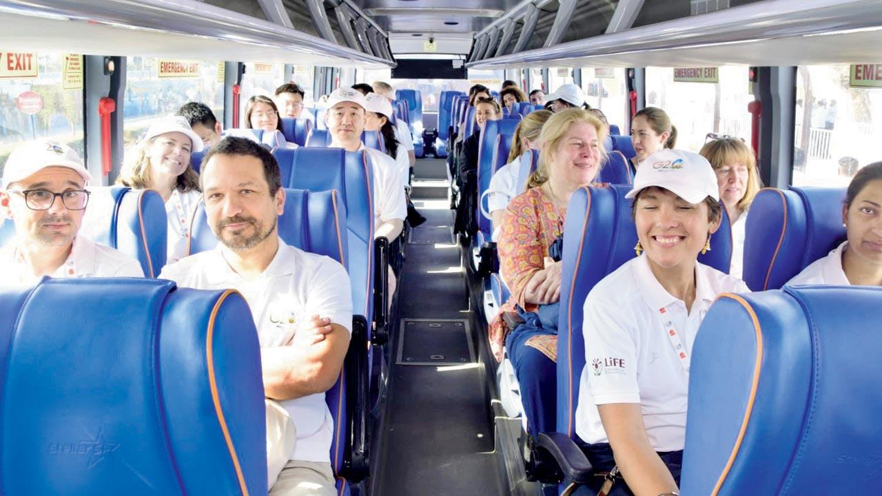 G20 delegates travelling aboard a premium BEST bus