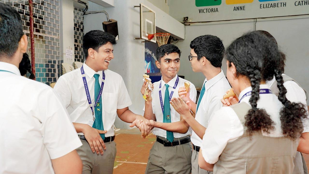  Students congratulate each other after getting their results