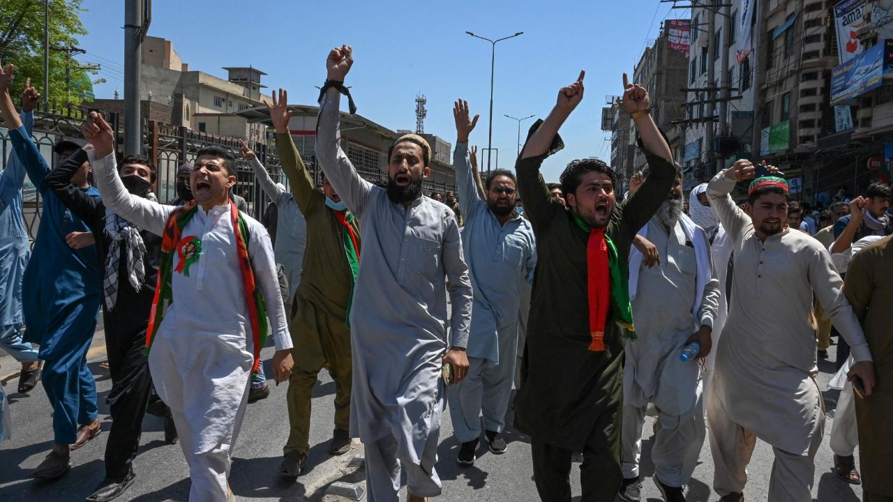 Pakistan Tehreek-e-Insaf (PTI) party activists and supporters of Imran Khan shout slogans during a protest against the arrest of their leader in Peshawar on May 10. Khan appeared in a special court at the capital's police headquarters on May 10 to answer graft charges, local media reported, a day after his arrest prompted violent nationwide protests