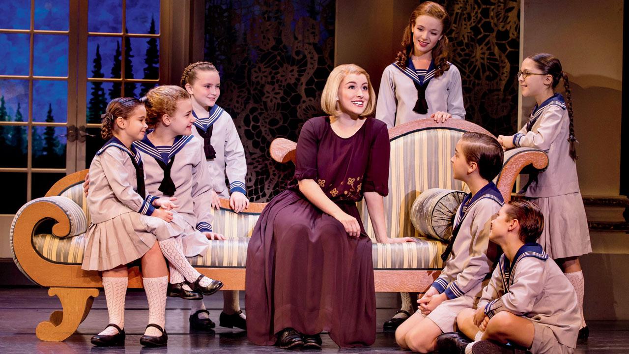 Maria with the kids in the Broadway show, The Sound of Music 