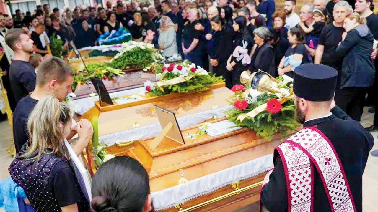 A funeral for five victims of the mass shooting in Serbia. Pic/AP