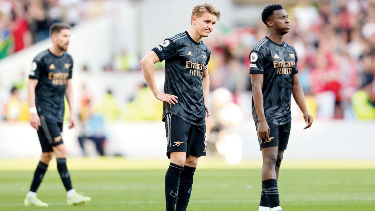 Arsenal’s Martin Odegaard (left) and teammate  wear a dejected look after Nottingham Forest register a 1-0 win over Gunners on Saturday