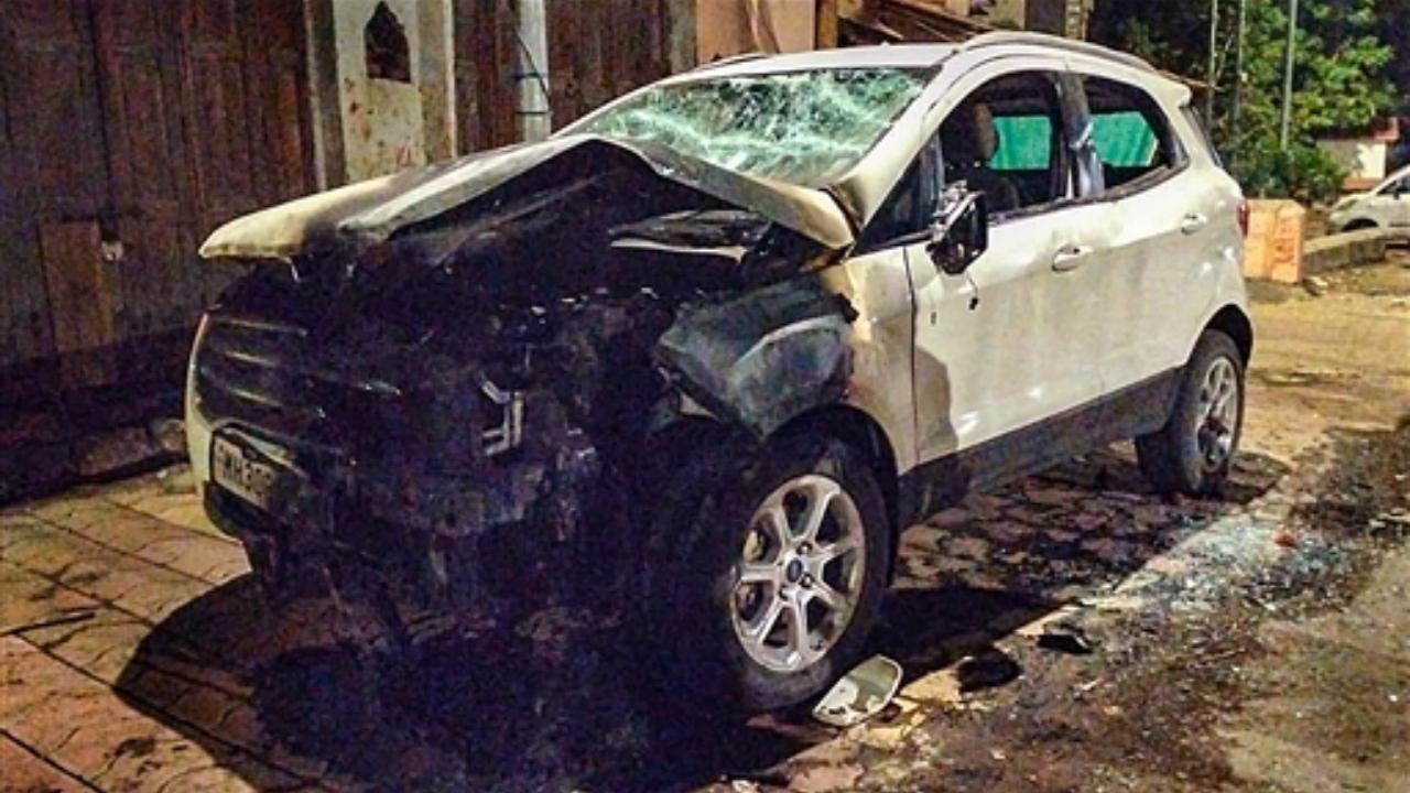 A vehicle damaged during a clash, that broke out between members of two communities over a social media post