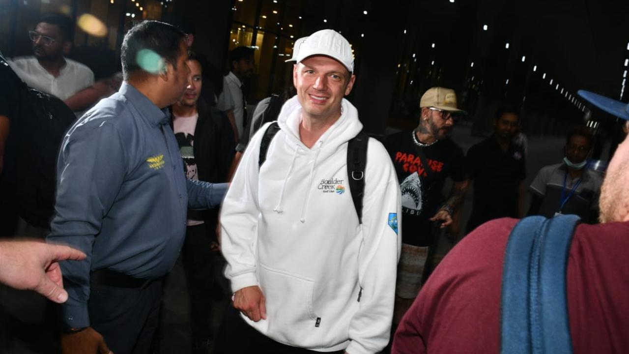 Nick Carter, one of the most popular of the band, was seen at the airport wearing a white sweatshirt and black shorts with a white cap.