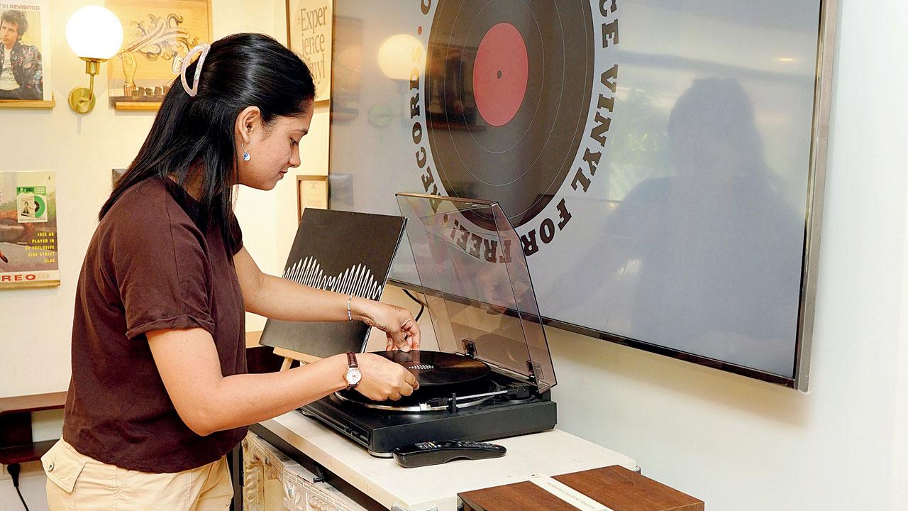 A patron puts on a record of her choice. Pics/Aishwarya Deodhar