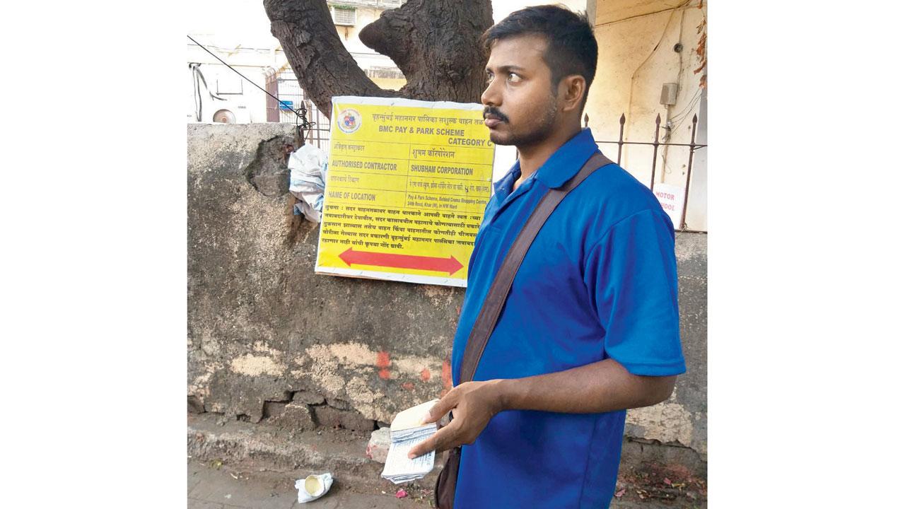 A BMC personnel collecting charges for parking near Patwardhan Park
