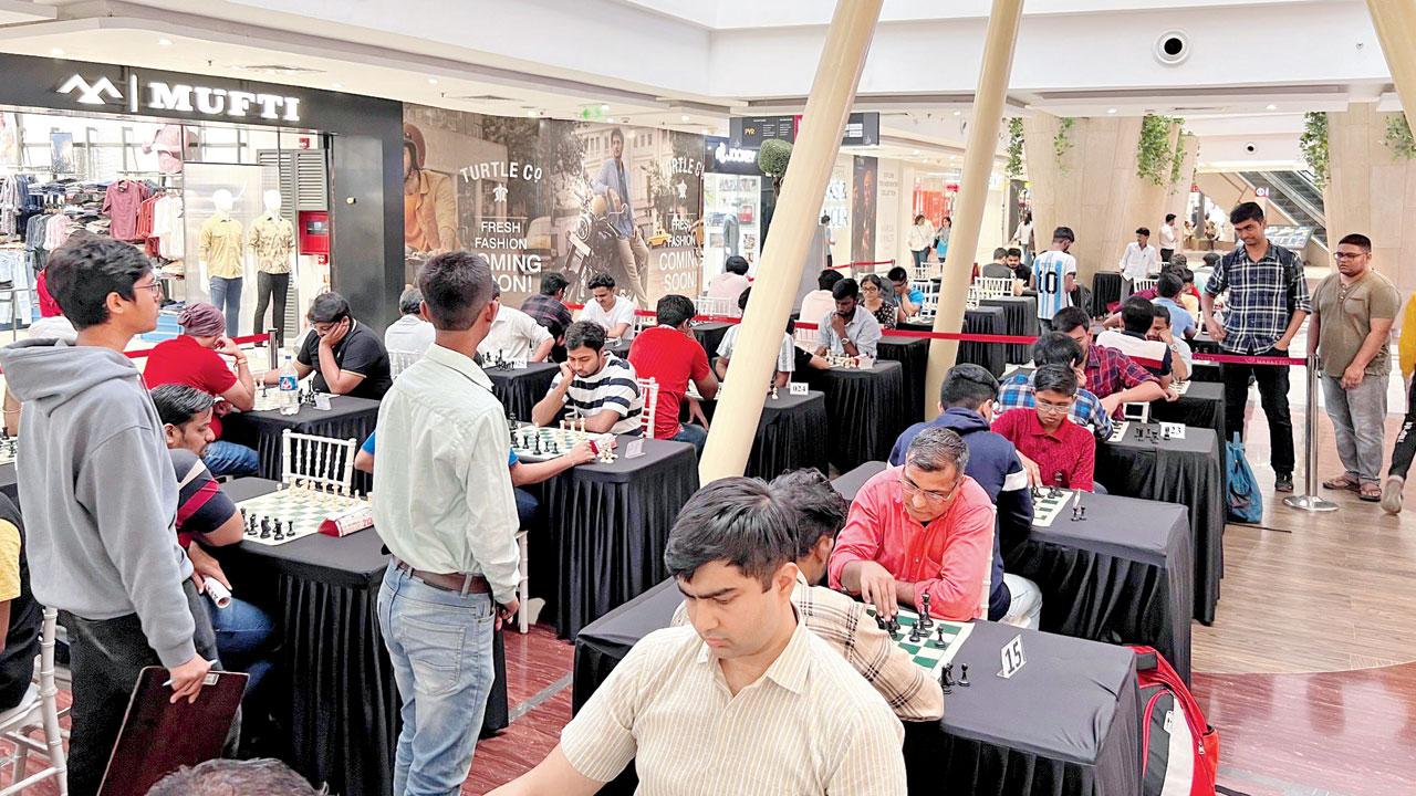 Participants enjoy a game of chess every Saturday at the mall