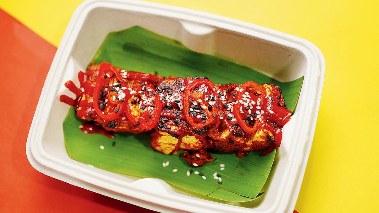 Red jalapeño tikka in an eco-friendly takeaway container