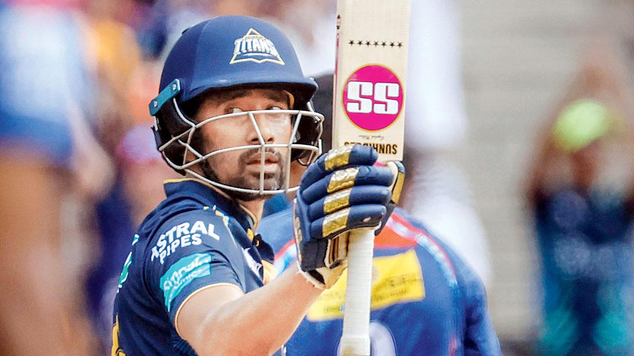 Wriddhiman Saha celebrates his 50 against LSG yesterday. Pic/PTI