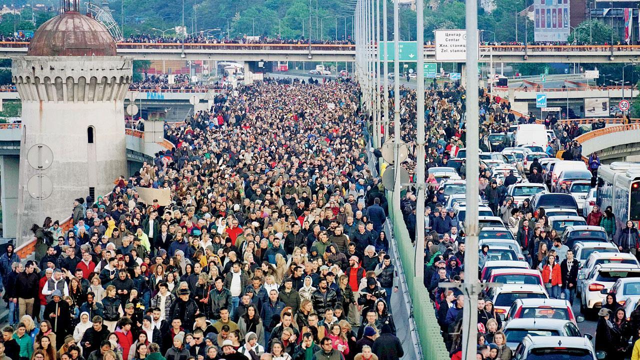 Serbians march to protest mass shootings
