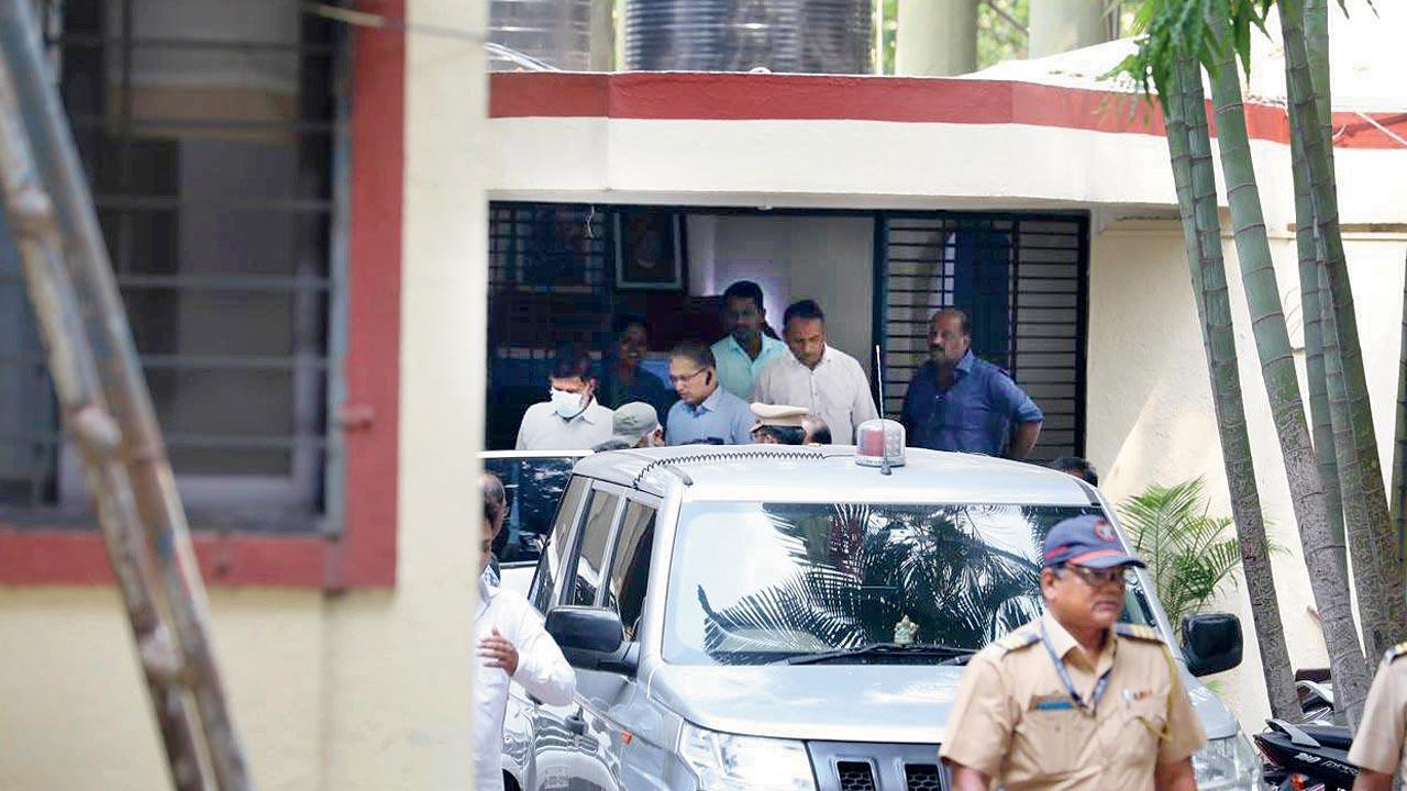 Pradeep Kurulkar (in mask) seen at the Anti-Terrorism Squad office in Pune on May 11 before being produced in court
