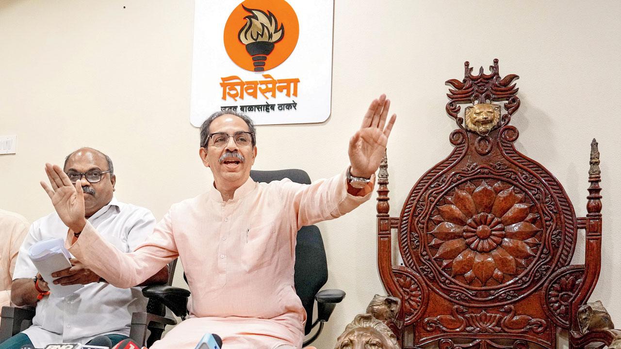 Uddhav Thackeray with party colleague Anil Parab during a press conference on Friday. Pic/PTI