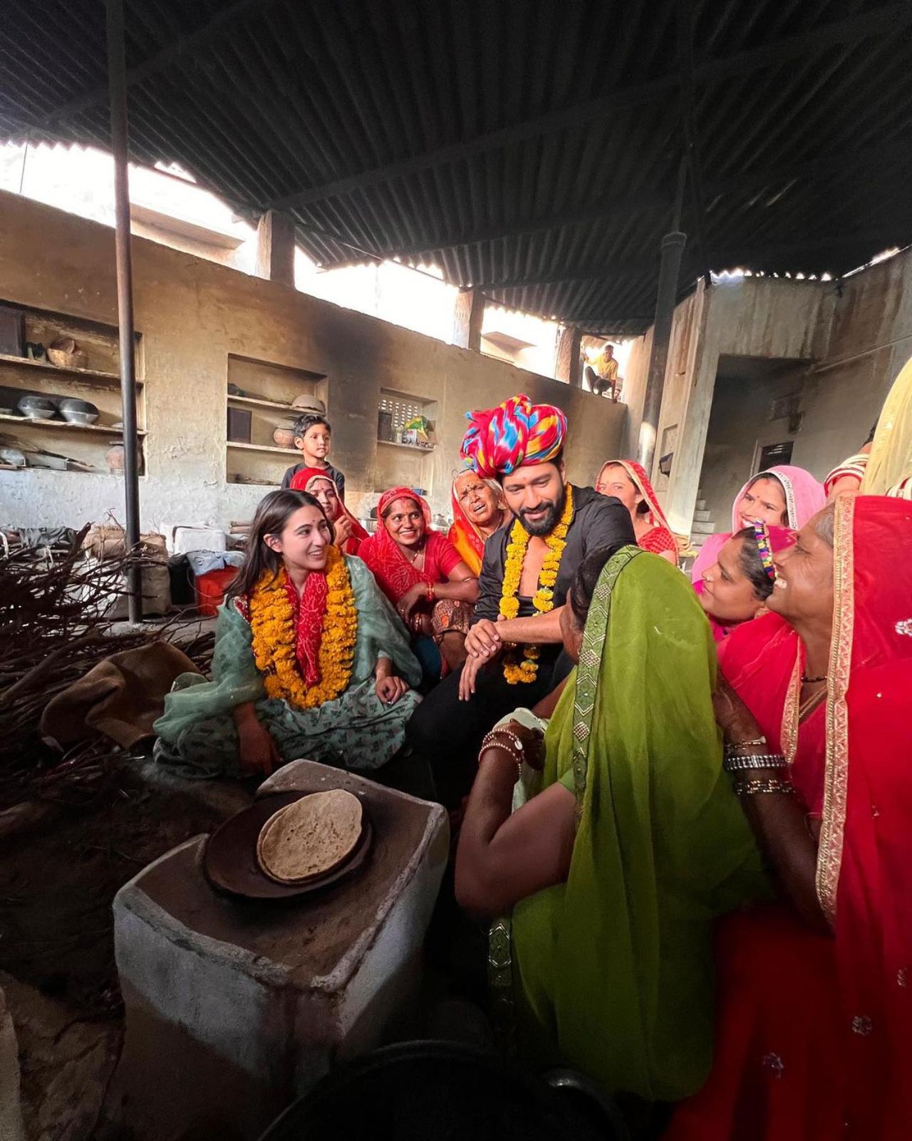 Vicky Kaushal and Sara Ali Khan, the lead stars of the upcoming film 'Zara Hatke Zara Bachke' headed to Rajasthan over the weekend to spend time with the locals of a village in the state. Sara was seen in a pastel green salwar kurta, while Vicky opted for a black shirt and pant for the visit. Vicky adorned the traditional Rajasthani headgear on his arrival