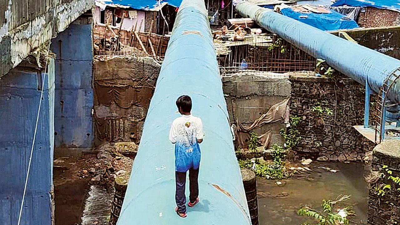 A boy walks over a pipe at Filterpada.  Pic Courtesy/Instagram