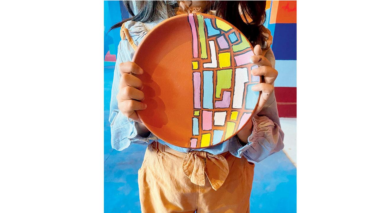The terracotta plate painting workshop is popular with kids