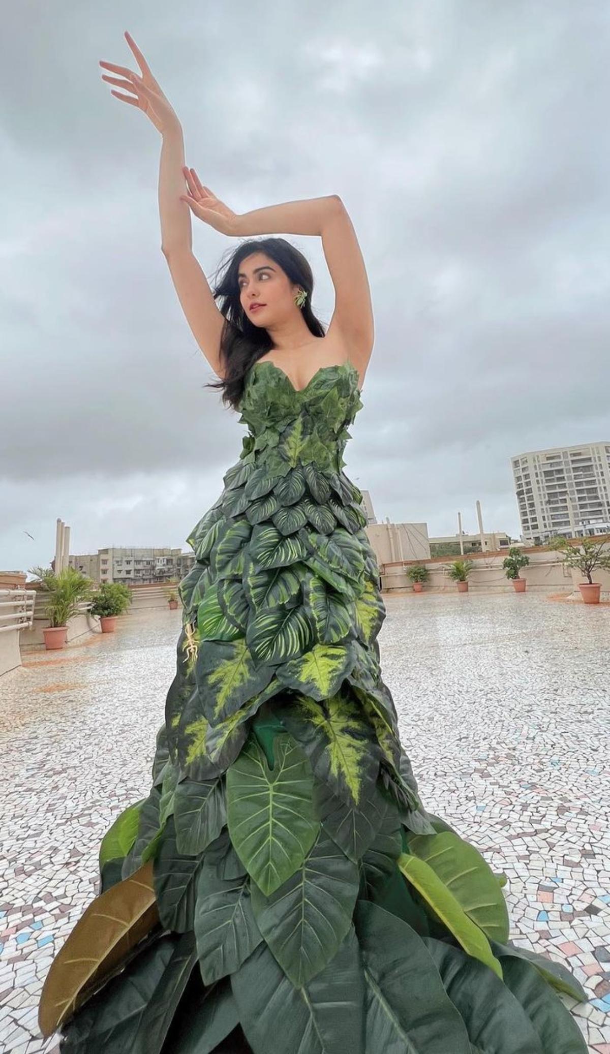 This look of Adah Sharma proves that she is the undisputed Queen of quirky fashion. 'The Kerala Story' star makes everybody's jaw drop as she dons a gown made up of artificial leaves. The actor raises her own bar of quirkiness as she decorates her unconventional gown with fake insects. To take the quirky quotient a notch higher, Adah accessorised her ears with insect earrings. Somebody, please send Sharmaji ki beti to MET Gala!
 