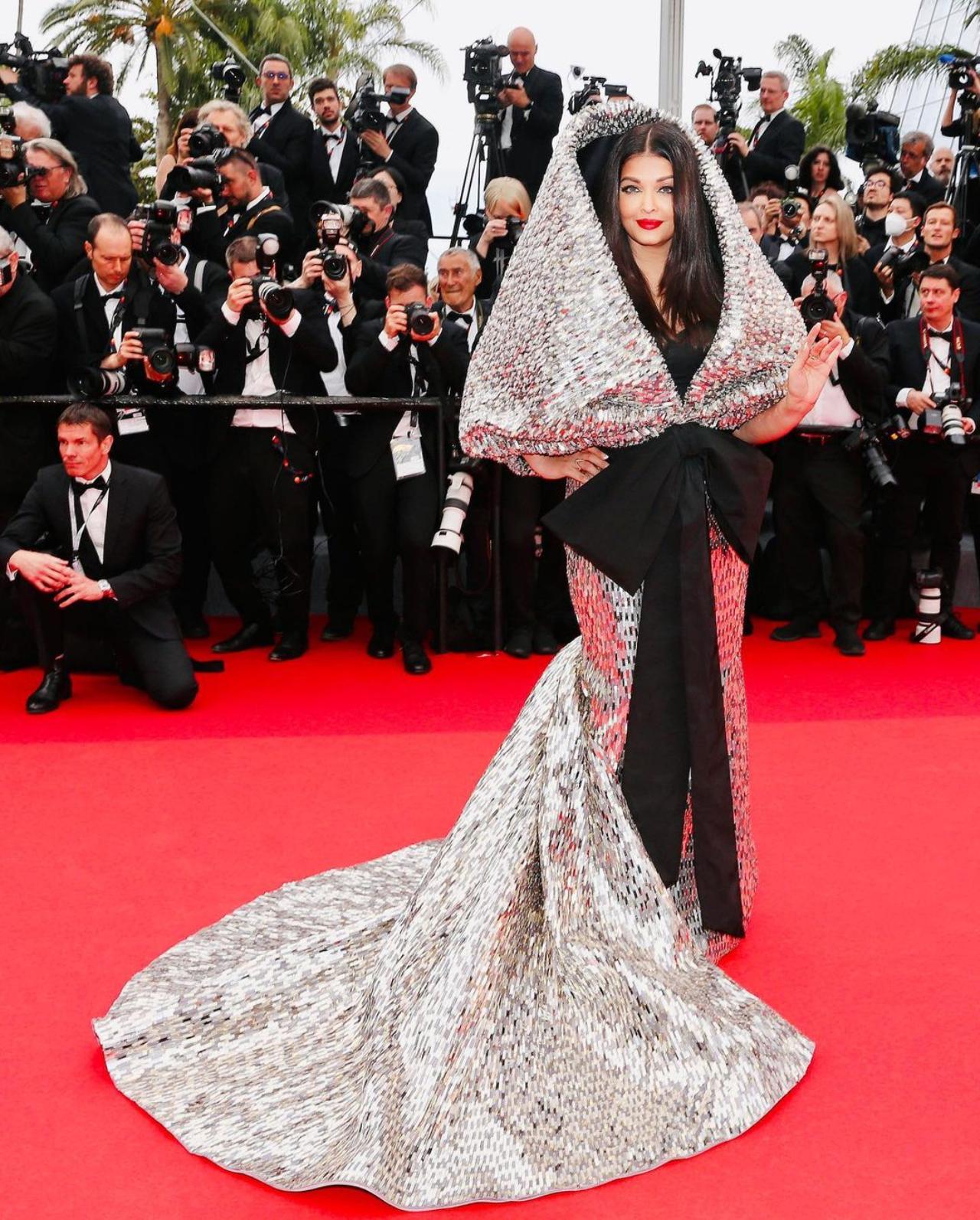 The Cannes veteran Aishwarya Rai Bachchan dressed herself in a black and silver hooded gown from the collections of Sophie Couture for her appearance at the festival this year. Read full story here 