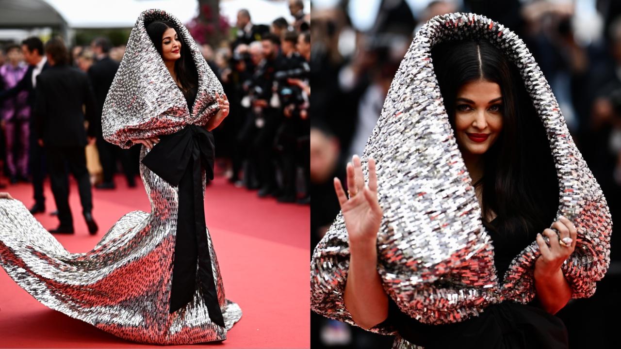 Aishwarya Rai BachchanThis Cannes veteran arrived and took everyone's breath away as usual. Sporting a shiny silver hooded black gown by Sophie Couture, the diva walked down the red carpet for the 22nd time making a bold fashion statement. Her bright red lipstick and high brows accentuated the look. She kept the accessories minimal by wearing a simple stone-studded ring. Photo Courtesy: AFP