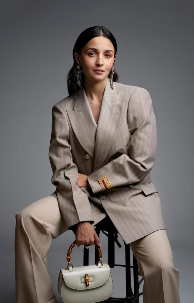 Sharing the news with her fans on Instagram, Alia posted a picture of herself in a power grey suit as she flaunted the Gucci Bamboo 1947 bag
