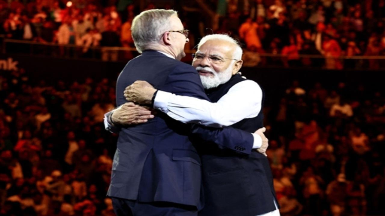 India's Prime Minister Narendra Modi (R) hugs Australia's Prime Minister Anthony Albanese during an event with members of the local Indian community at the Qudos Arena in Sydney on May 23, 2023. Photo AFP