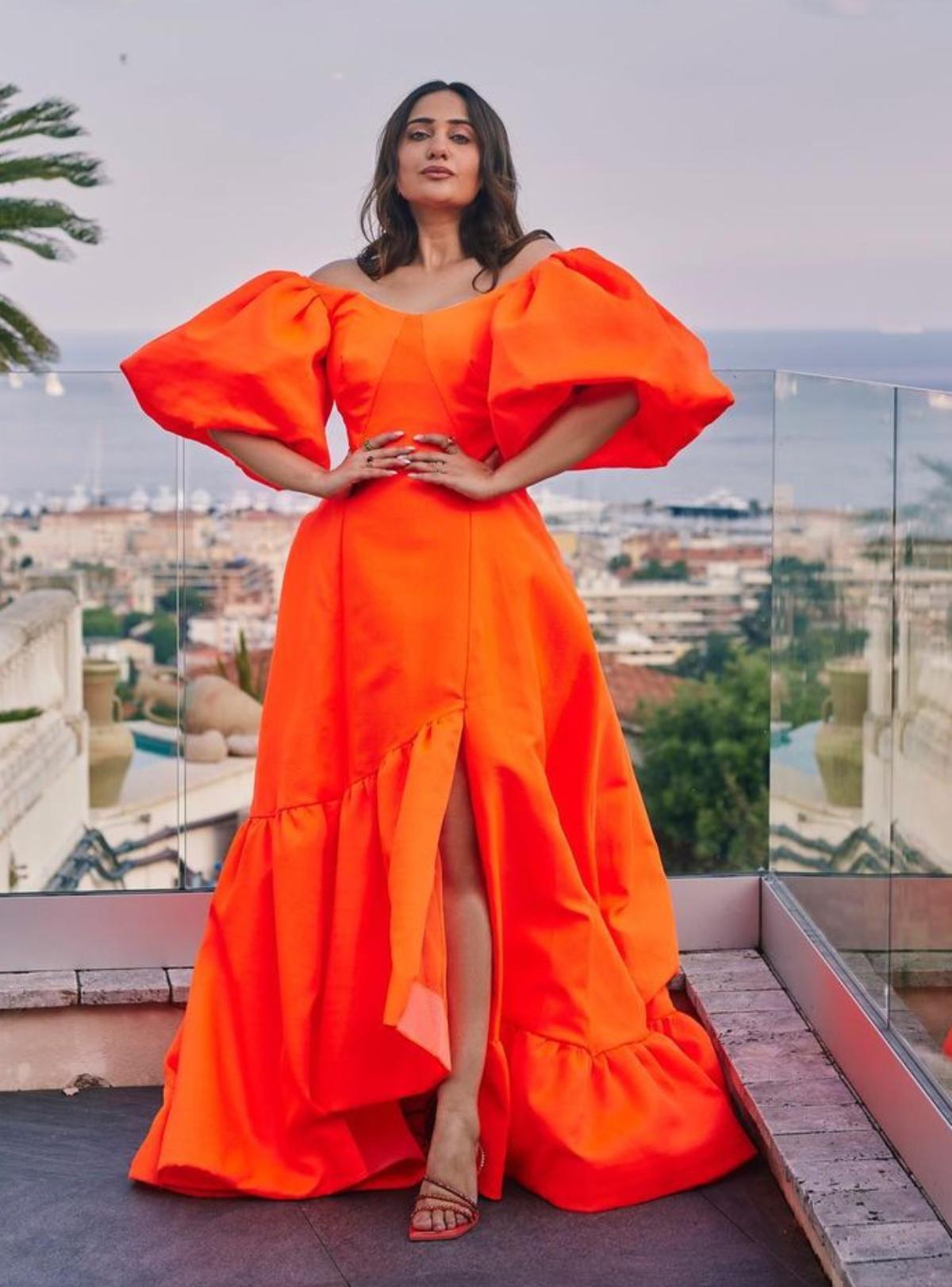 One of the biggest social media content creators, 'Comedy Queen', Kusha Kapila who is all set to walk the coveted red carpet of the 76th Cannes Film Festival, painted the streets of France orange as she stepped out in a gorgeous orange knee-slit flowy gown. 