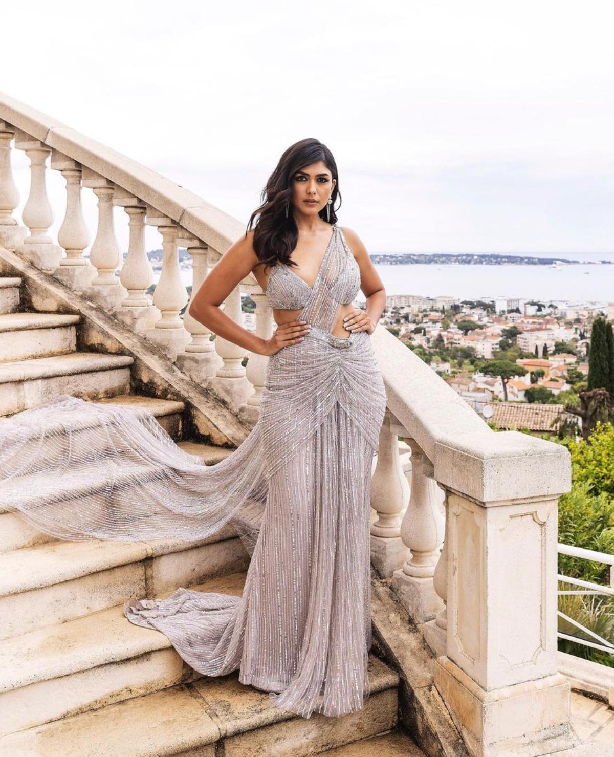 Another Cannes debutante from Bollywood, actor Mrunal Thakur who walked the coveted red carpet for the first time on day 2, made heads turn as she arrived wearing a shimmery lavender saree-styled gown from Falguni Shane Peacock. 