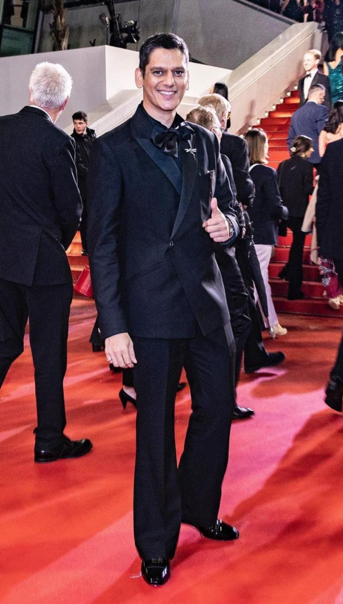 The 'Dahaad' actor, Vijay Varma who walked the coveted Cannes red carpet for the second time on day 2, stole the spotlight as he walked the red carpet wearing a chic black suit, which consisted of a black coat and matching trousers. The actor looked dapper as he accessorised his red carpet ensemble with a silver dragonfly borch and a unique black silk bow tie.