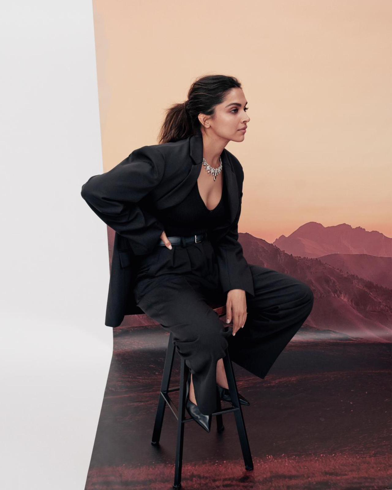 Giving us some French-fashion vibes, Deepika sports a relaxed black suit with stilettos and simple pulled back hair.