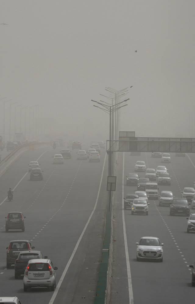 Traffic chaos in Delhi worsens as air pollution levels soar, causing long delays and respiratory distress.