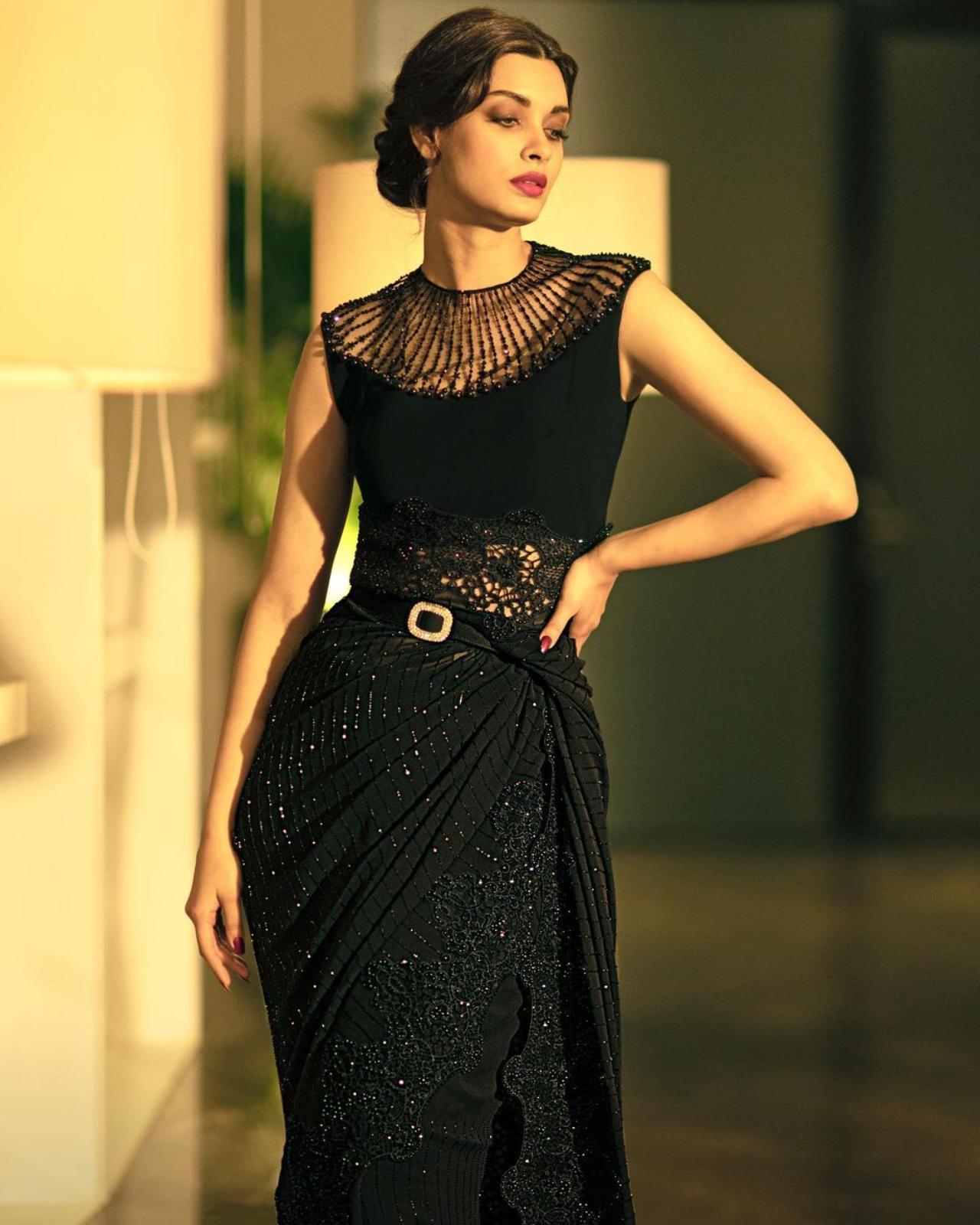 Here's Diana giving the desi nine yards a modern twist. The actress opted for a shiny saree with intricate details and completed the look with a retro hairstyle and some dramatic make-up