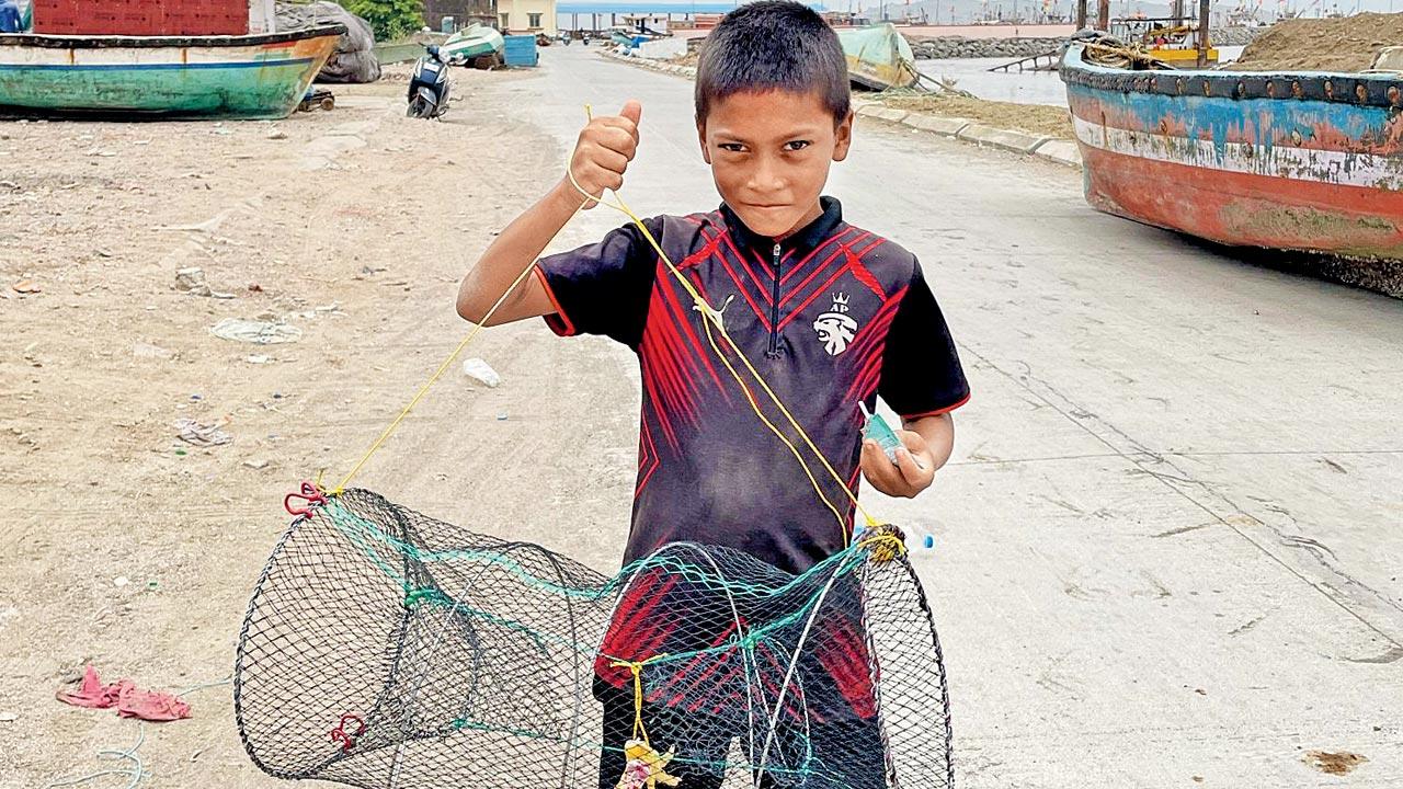 A boy with a lobster pot in California. Pic Courtesy/Ganesh Nakhawa