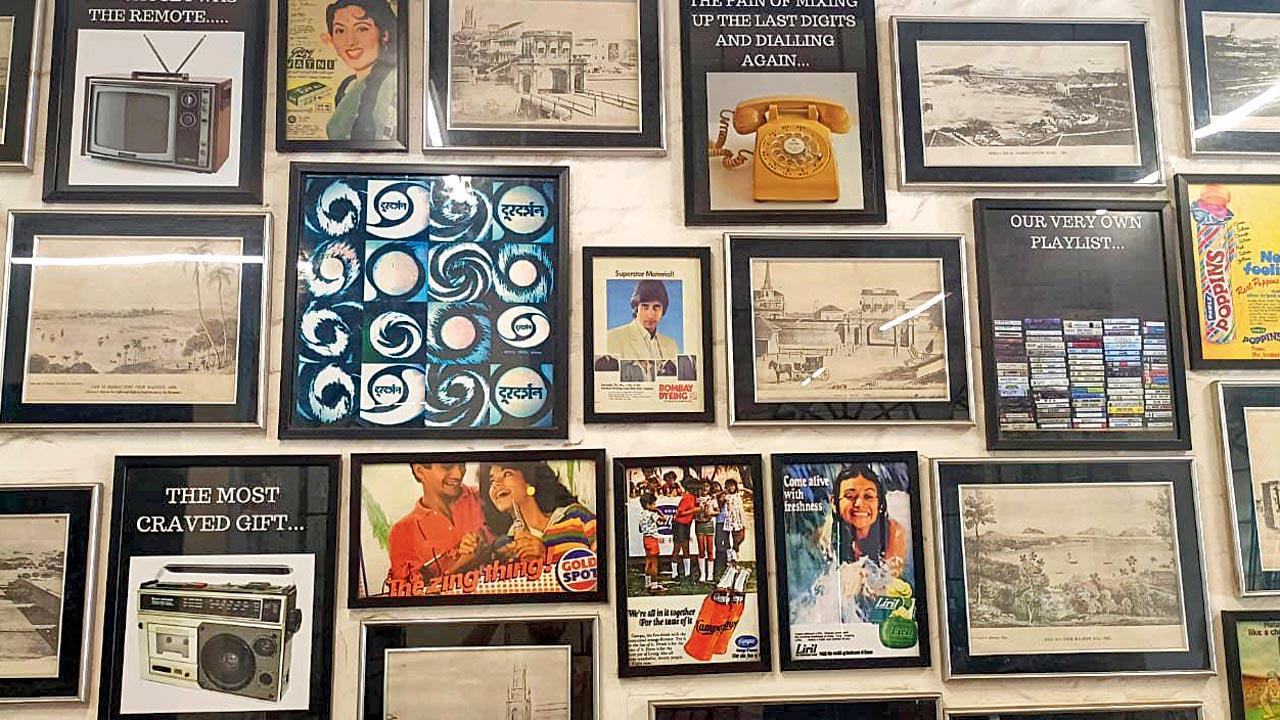 A section of the wall in Cafe Paramount that sports print ads from earlier decades