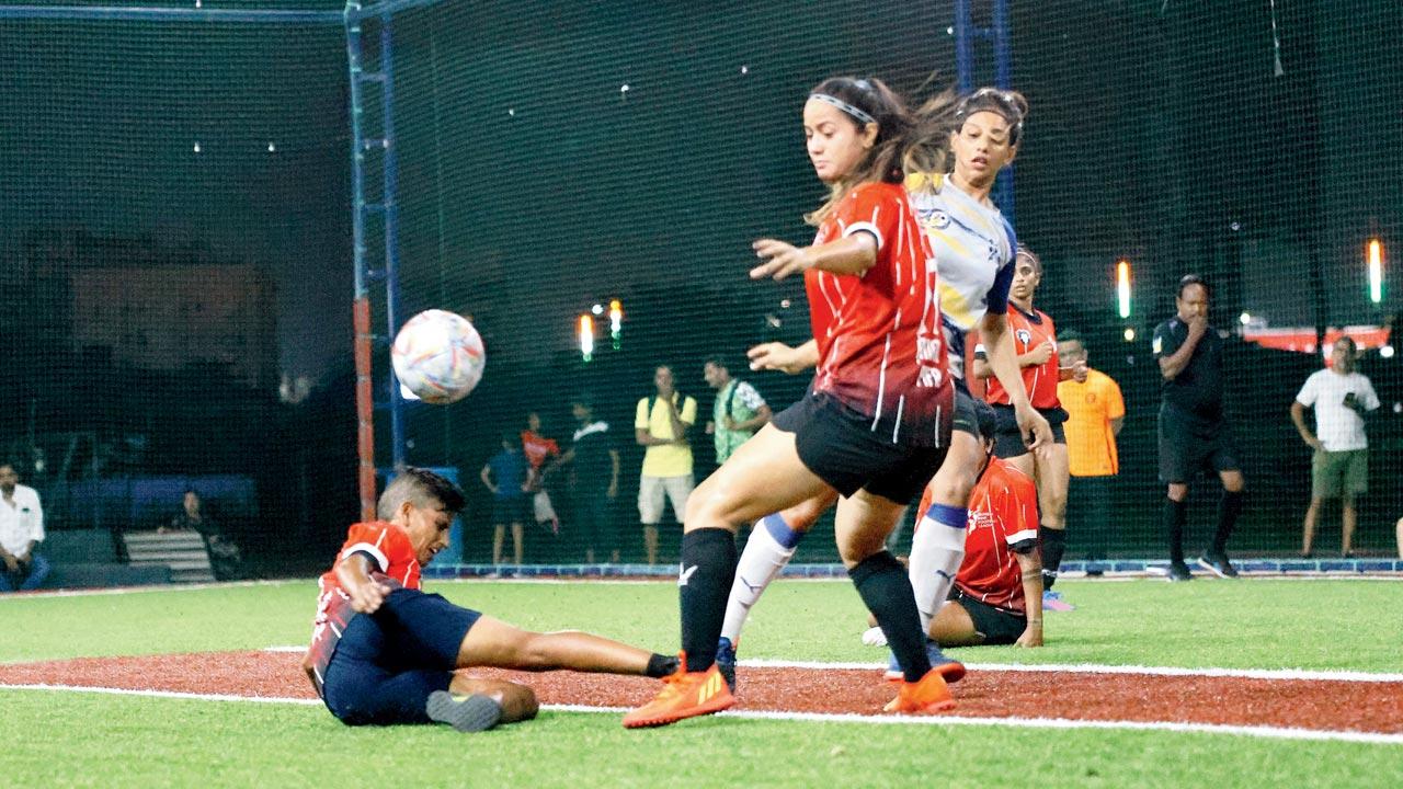 The PIFA Colaba team (in red) defend their goal