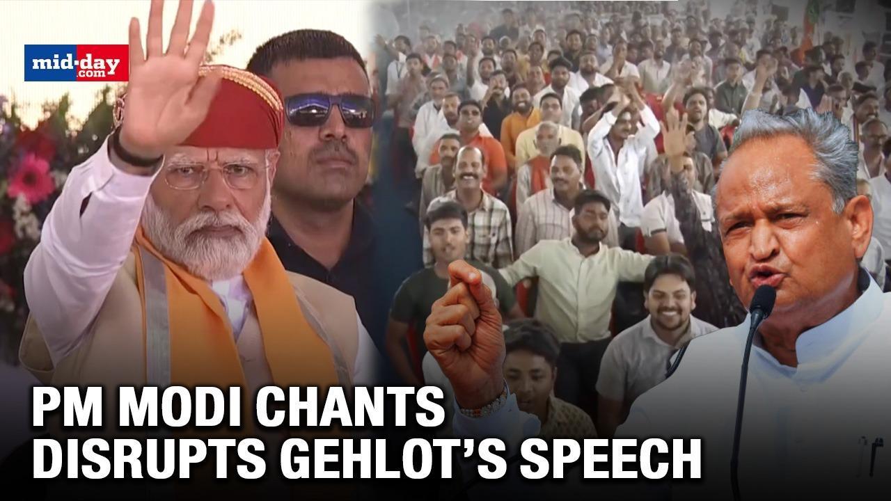 PM Modi signals crowd to calm down as they chant his name during Gehlot's speech