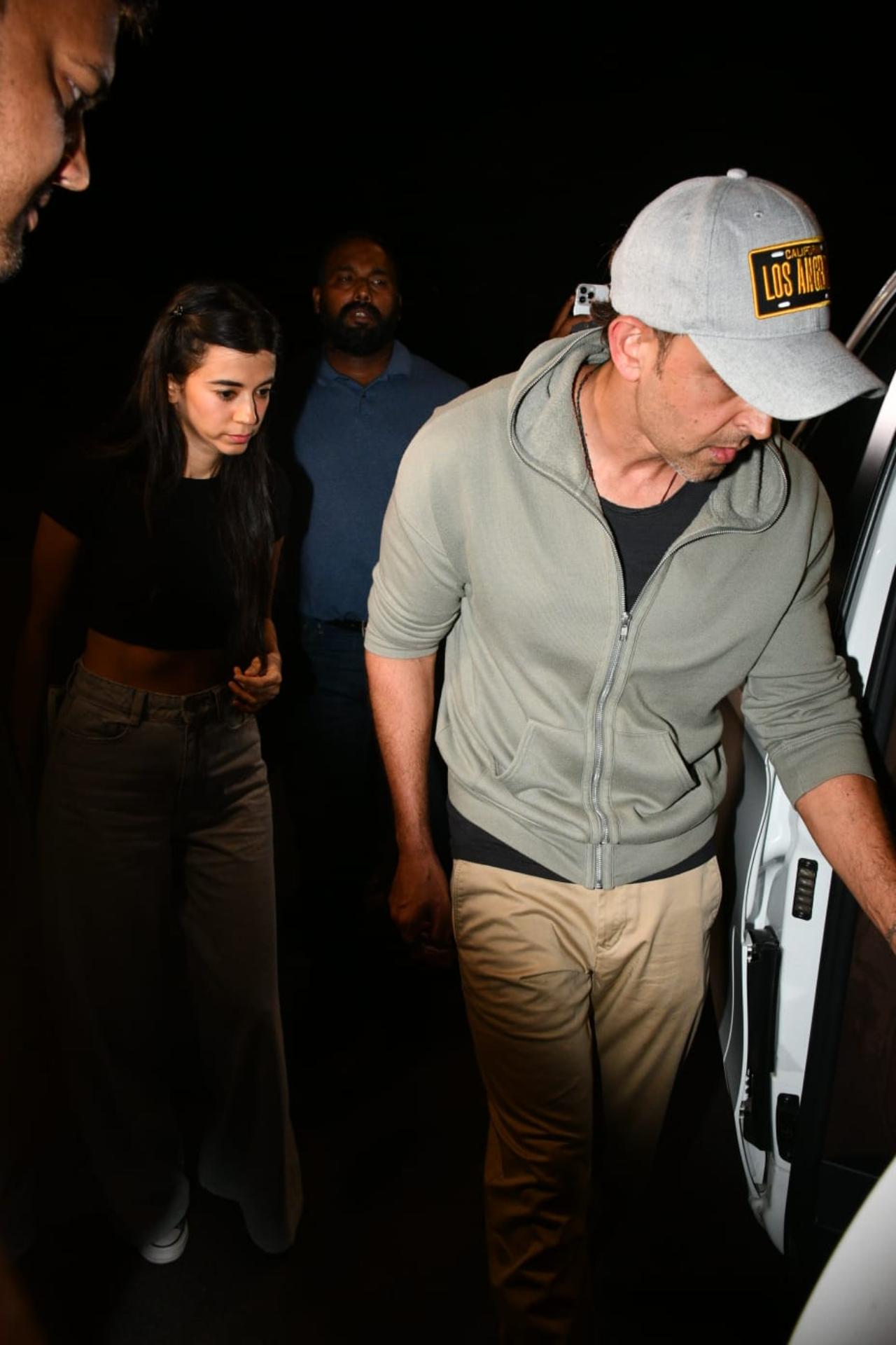 Hrithik can be spotted rocking a black T-shirt, an olive green jacket, uber cool khaki pants and a cap. Meanwhile, Saba opted for a classic cropped black T-shirt and denims.
