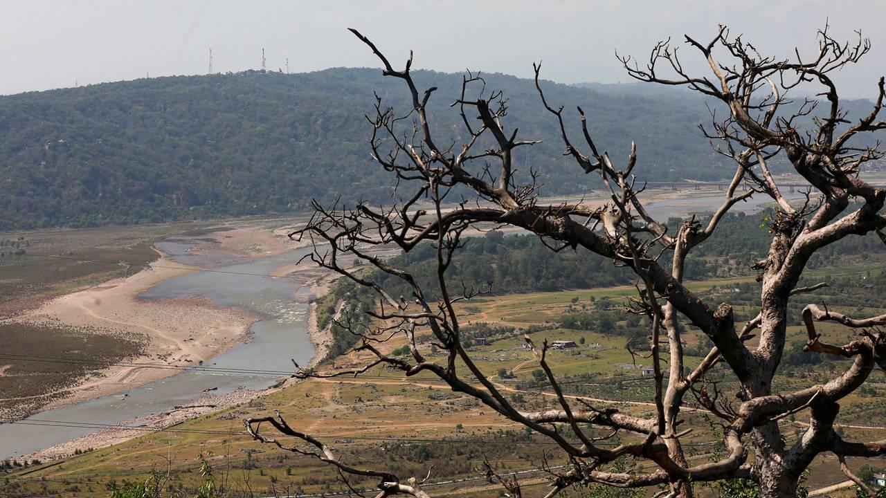Partially dried up river bed of Tawi river during a hot summer day, in Jammu, Friday, May 19, 2023. Pic/PTI