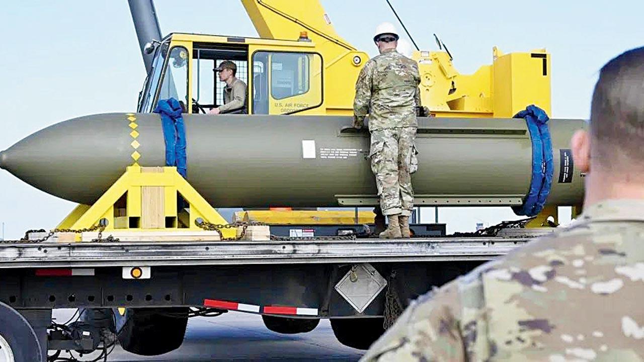 Airmen inspect the Massive Ordnance Penetrator bomb at Whiteman Air Base. Pic/AP