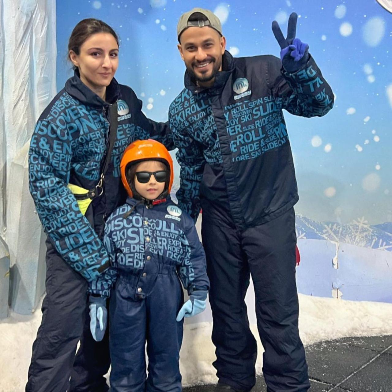 The family twins in cold weather outfits as they pose at what looks like Snowworld. Inaaya looks adorable in a blue jumpsuit and an orange cap
