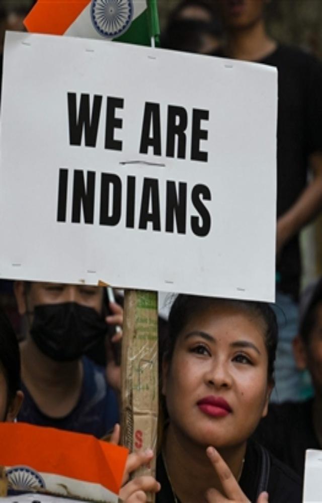 During the protest, women gathered and held posters and national flags