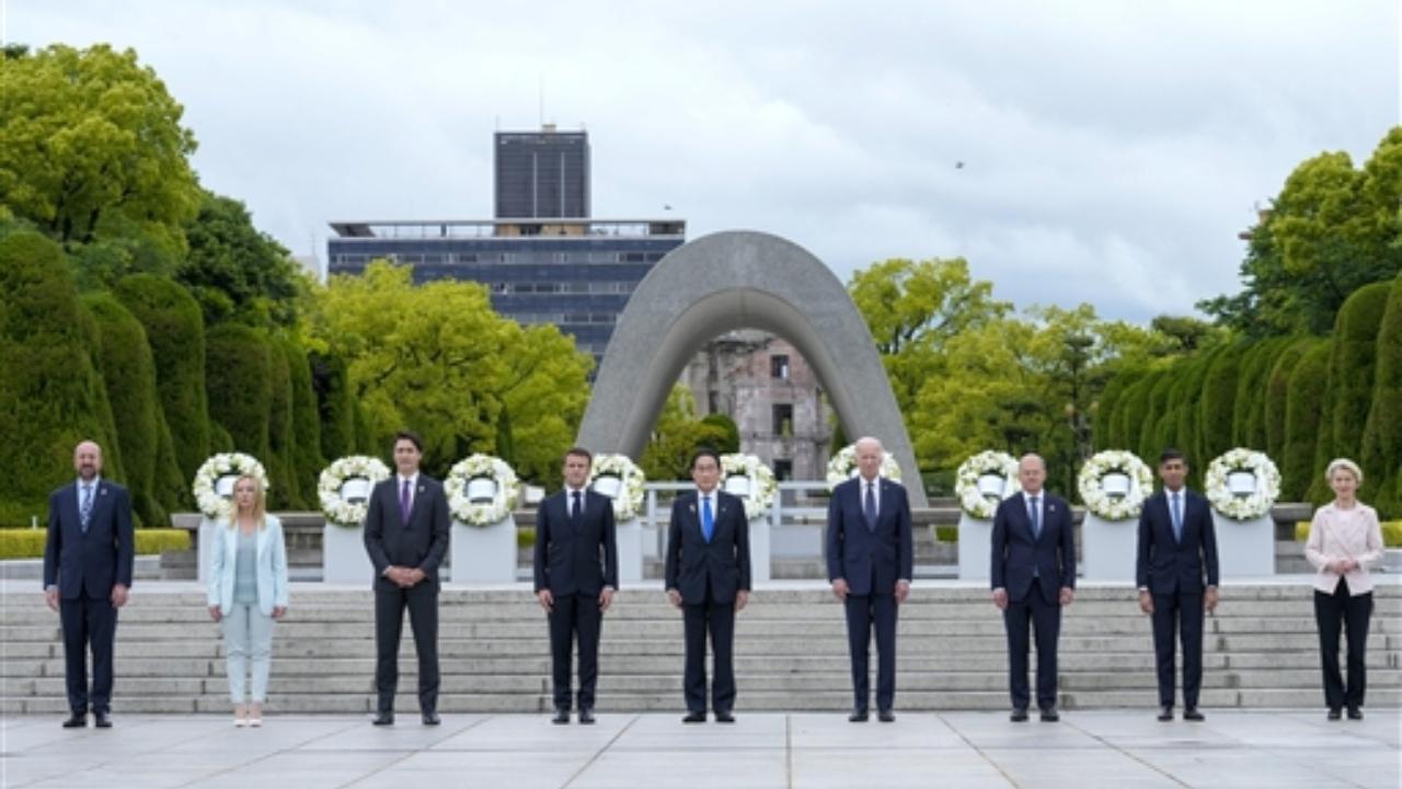 President Joe Biden, fourth right, and other G7 leaders pose for a photo during a visit to the Hiroshima Peace Memorial Park in Hiroshima, Japan, Friday, May 19, 2023, during the G7 Summit