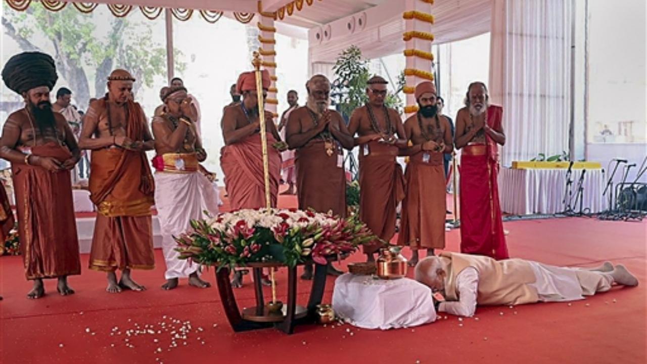 Prime Minister Narendra Modi prostrates before the 'Sengol' at the inauguration of the new Parliament building