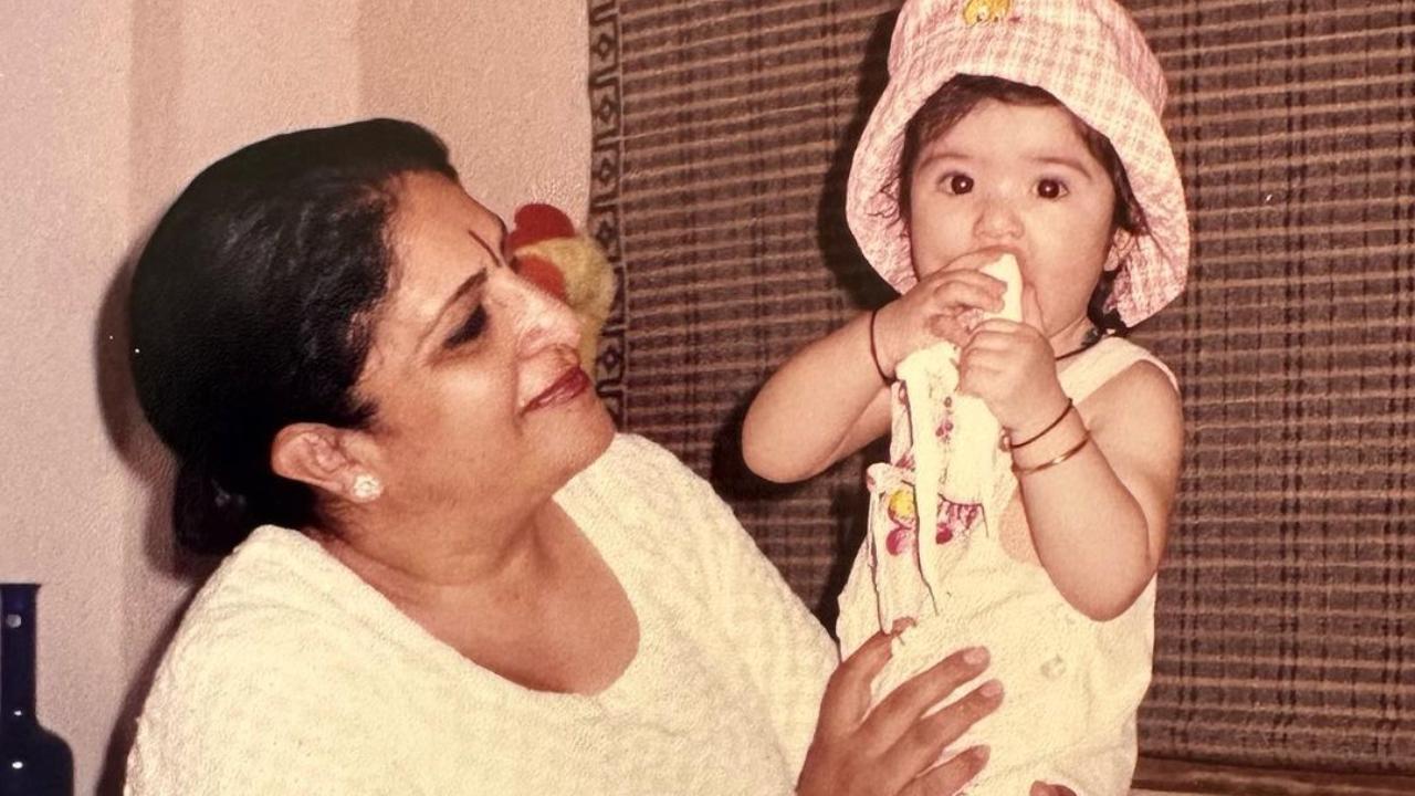 Baby Maheep Kapoor is in her mother's arms, as she is looking very cute in the picture.