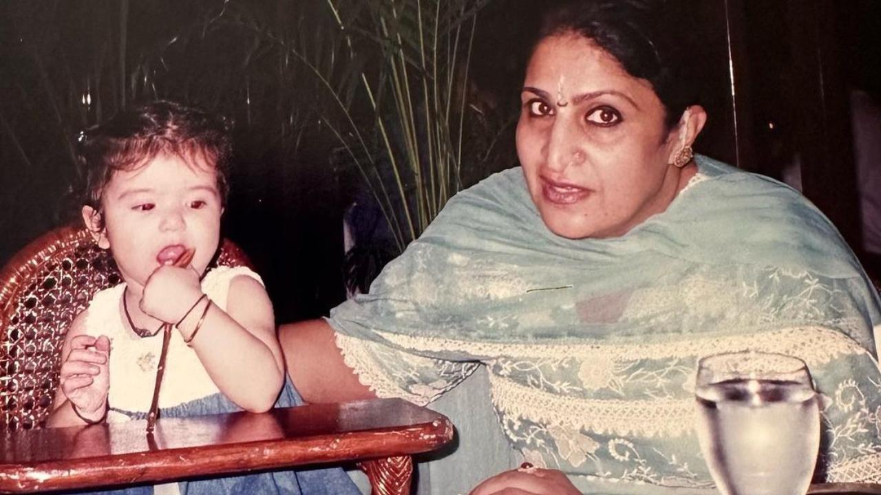 Namita Sandhu is posing for a picture, and Maheep Kapoor is playing beside her mom at the dining table.