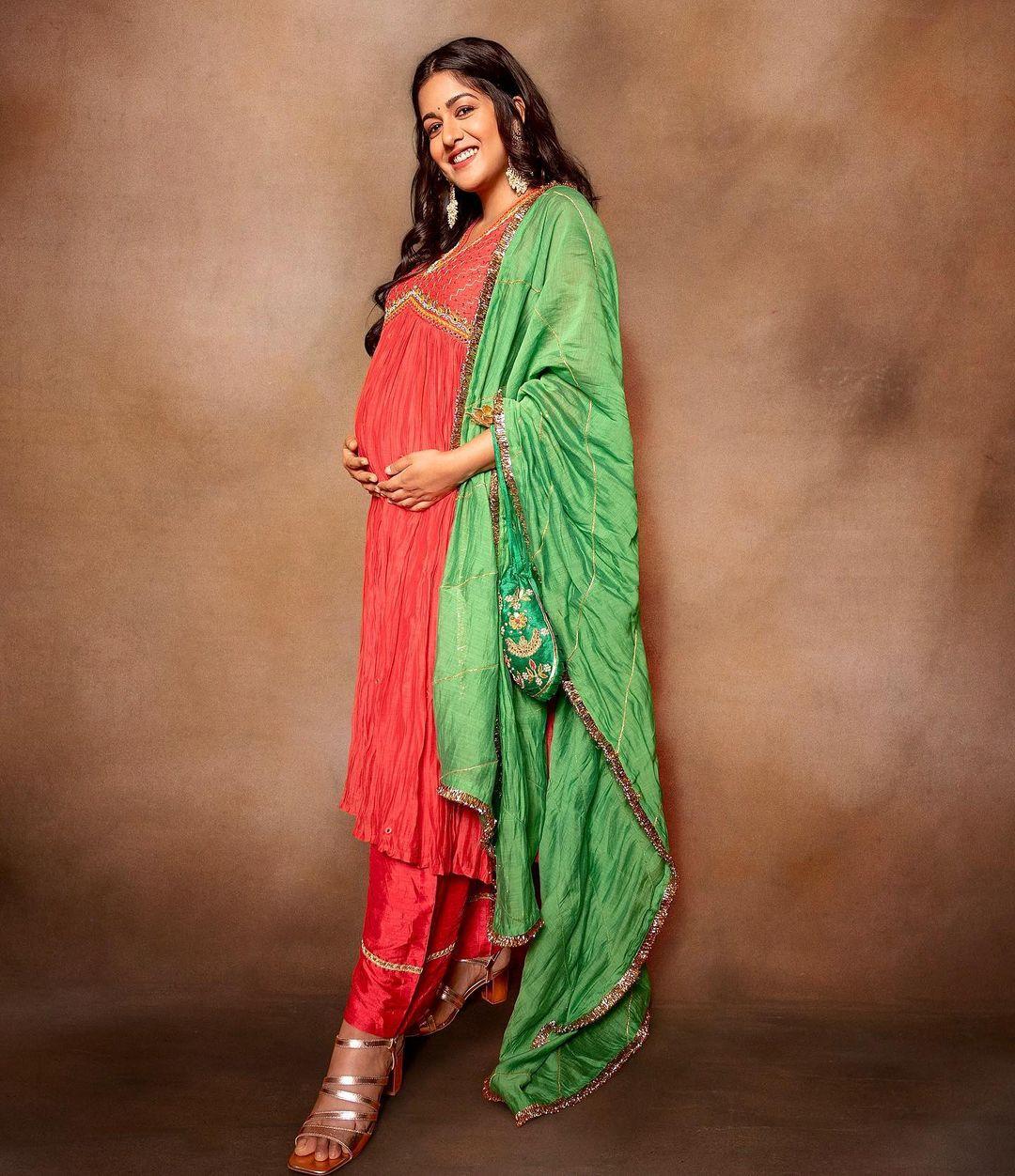 'Drishyam' actress and mum-to-be Ishita Dutta, kept it ethnic in an embroidered red and green salwar suit. The potli purse and jhumkas added to the look.
