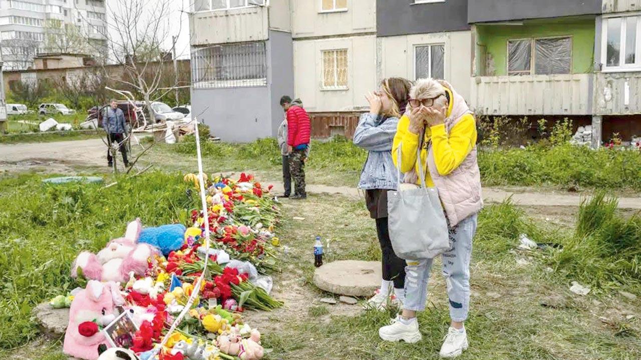 Relatives bury children killed in Russia’s Friday missile attack
