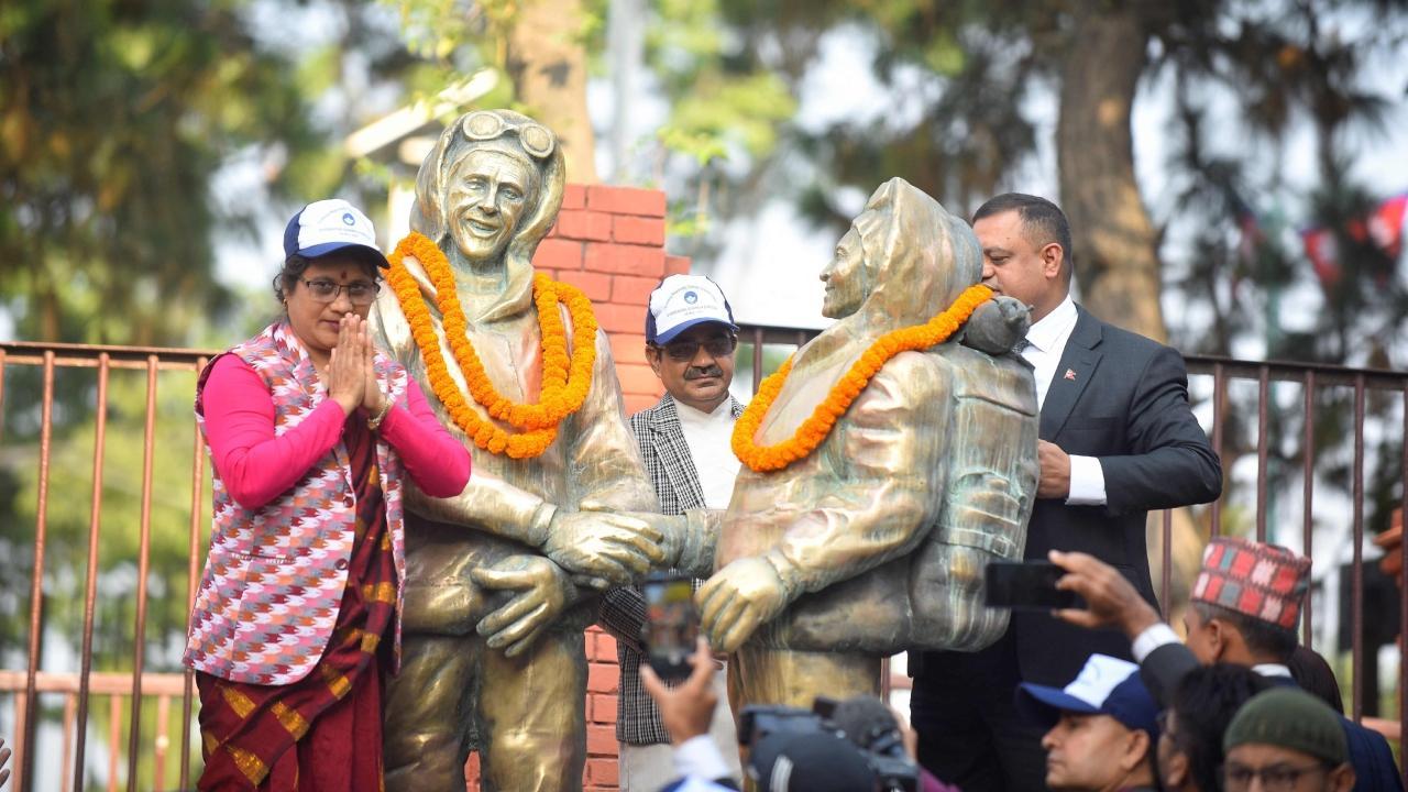 Nepali government officials place garlands on the statues of New Zealand's Sir Edmund Hillary and Nepal's Tenzing Norgay Sherpa. Pics/AFP