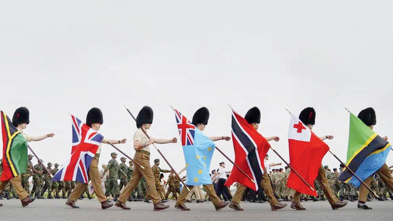 Guards carry flags from Commonwealth countries during a full  tri-service and Commonwealth rehearsal at RAF Odiham. Pic/AP